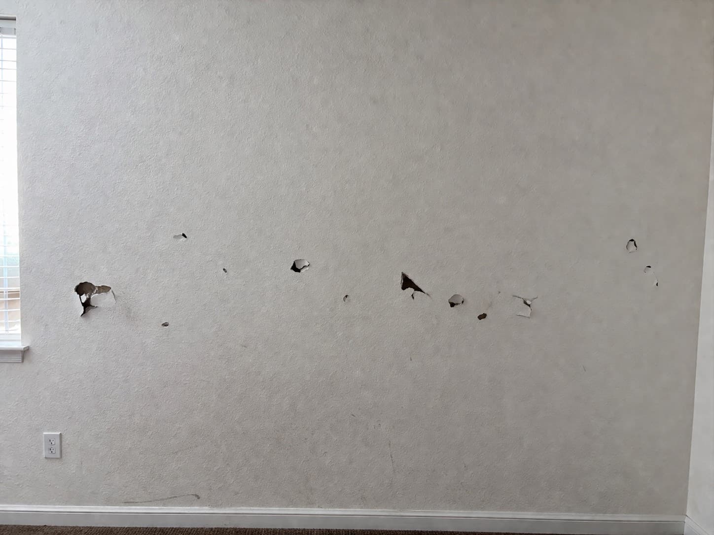 Wall damage before drywall repair